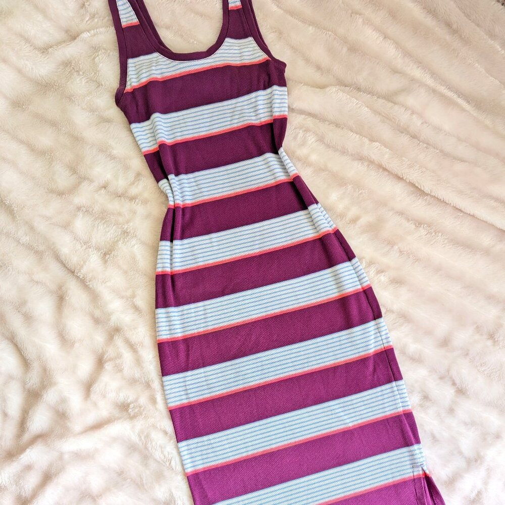 Colorfully stripped, form fitting maxi dress with leg slit